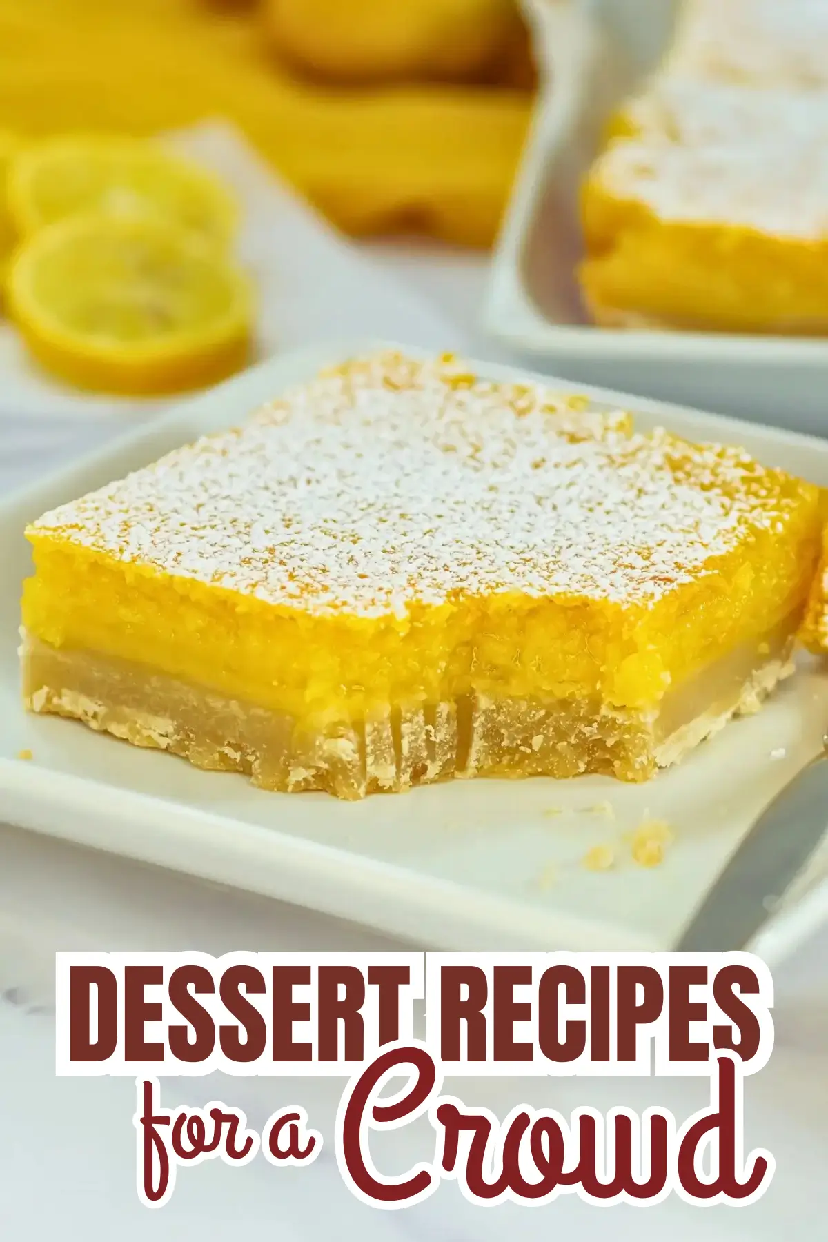 Lemon bars with powdered sugar on a plate—easy dessert recipe for a crowd