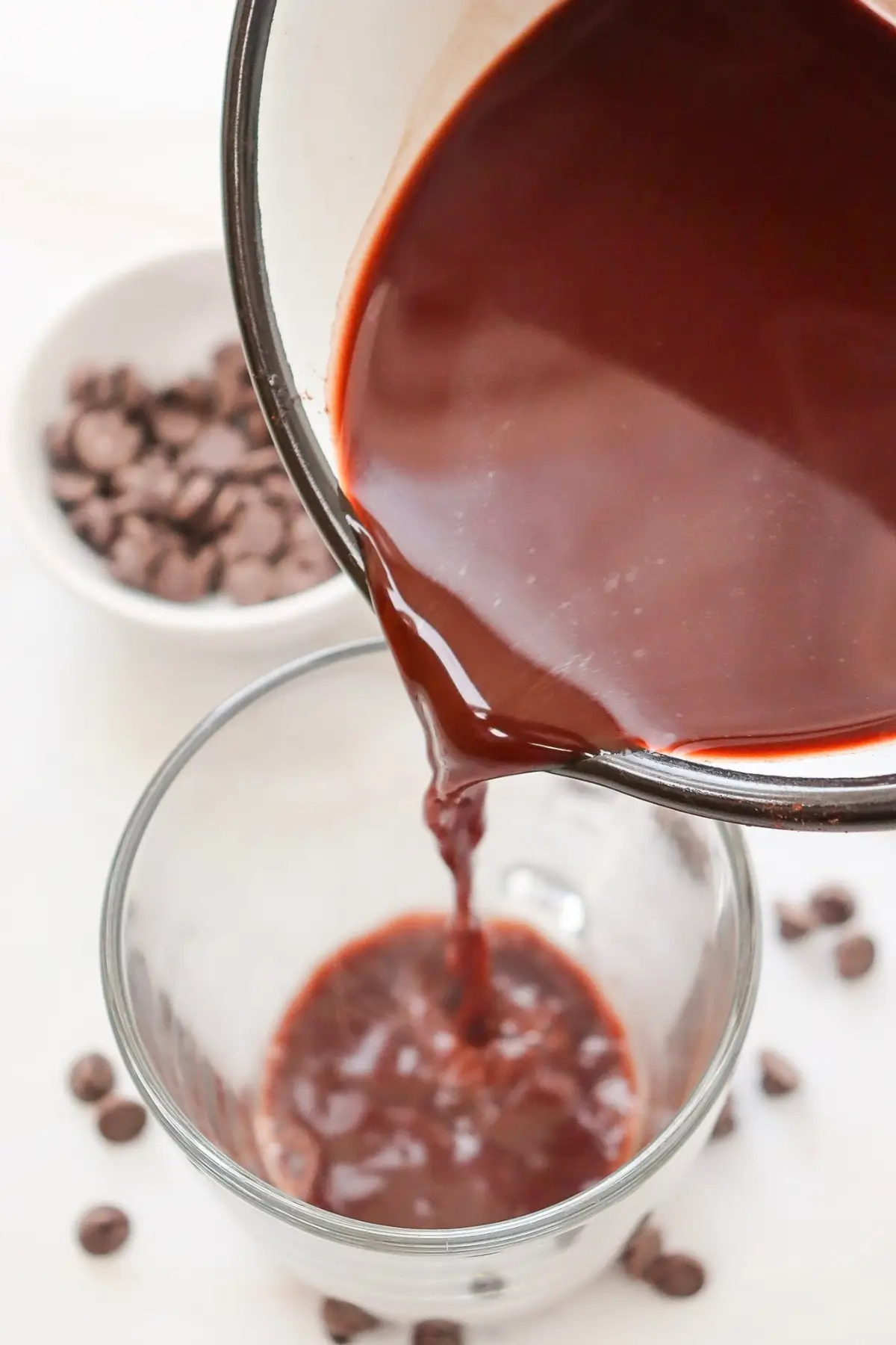 Pouring sugar-free hot chocolate with almond milk into a glass