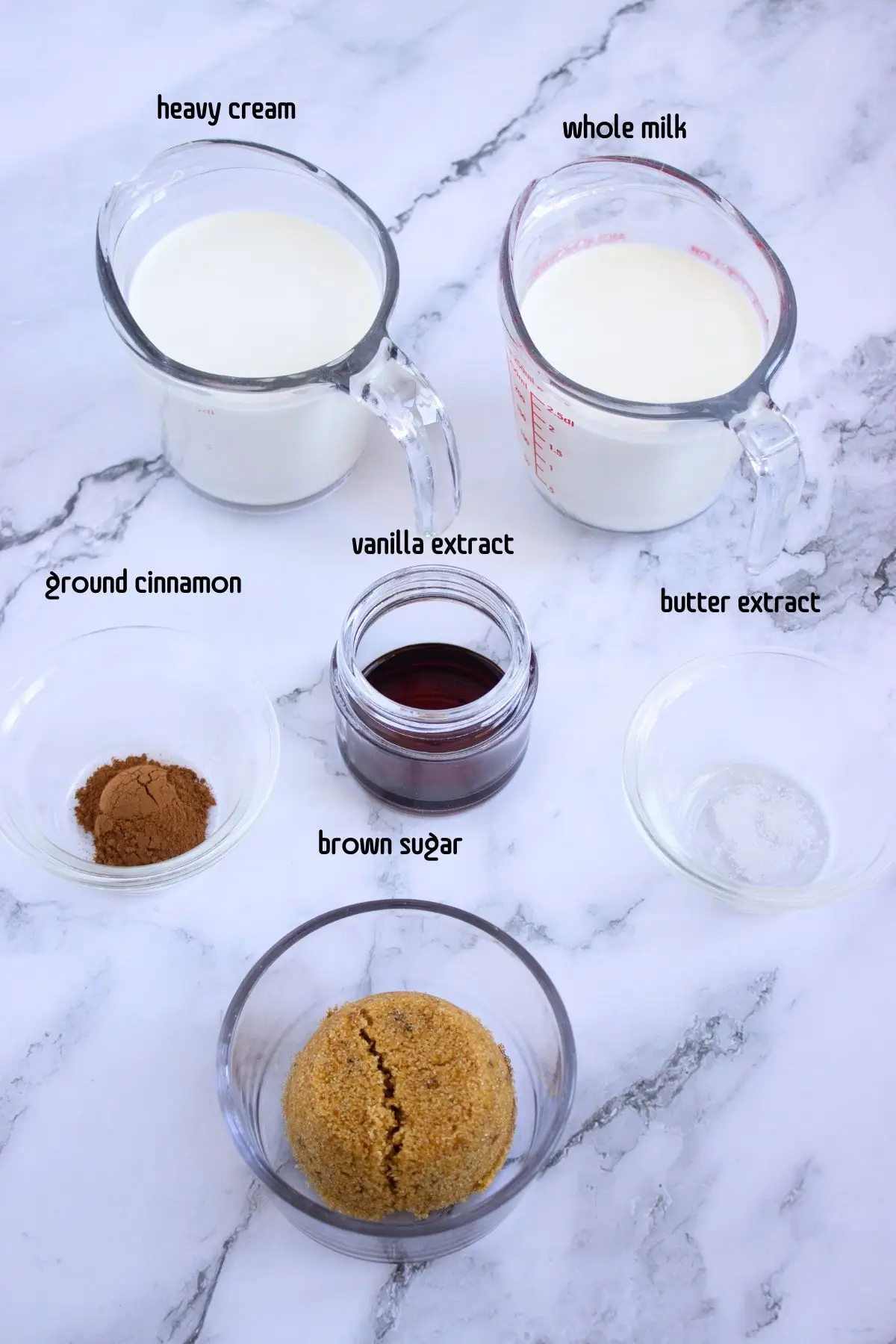 Homemade Cinnamon Vanilla Creamer (Cinnabon-Style) Close-up of ingredients for a DIY coffee creamer base: ground cinnamon, butter extract, and vanilla
