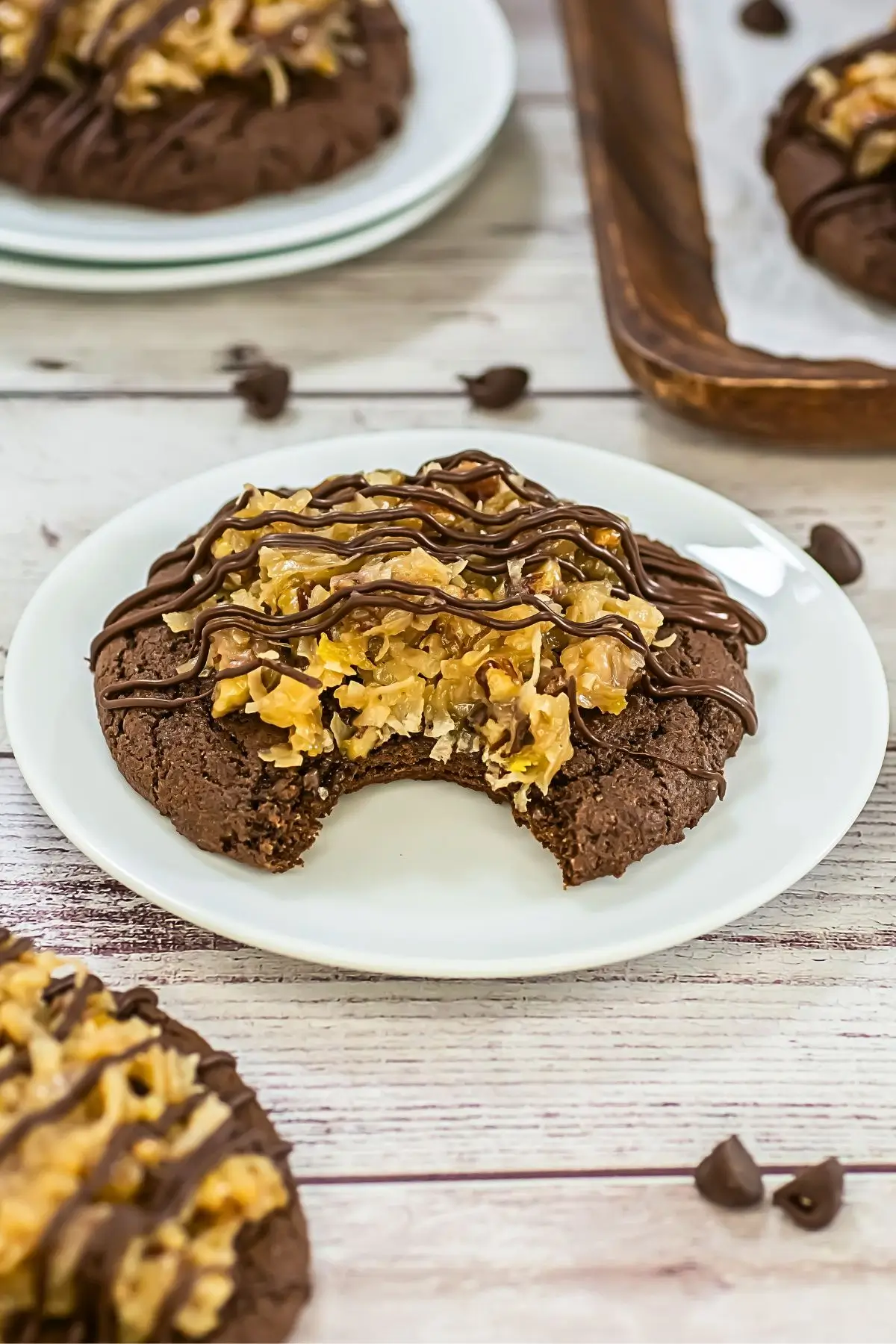 German Chocolate Cake Crumbl Cookies Close-up of a fudgy German chocolate cake Crumbl cookie with coconut pecan frosting and chocolate drizzle, showing soft chewy texture.