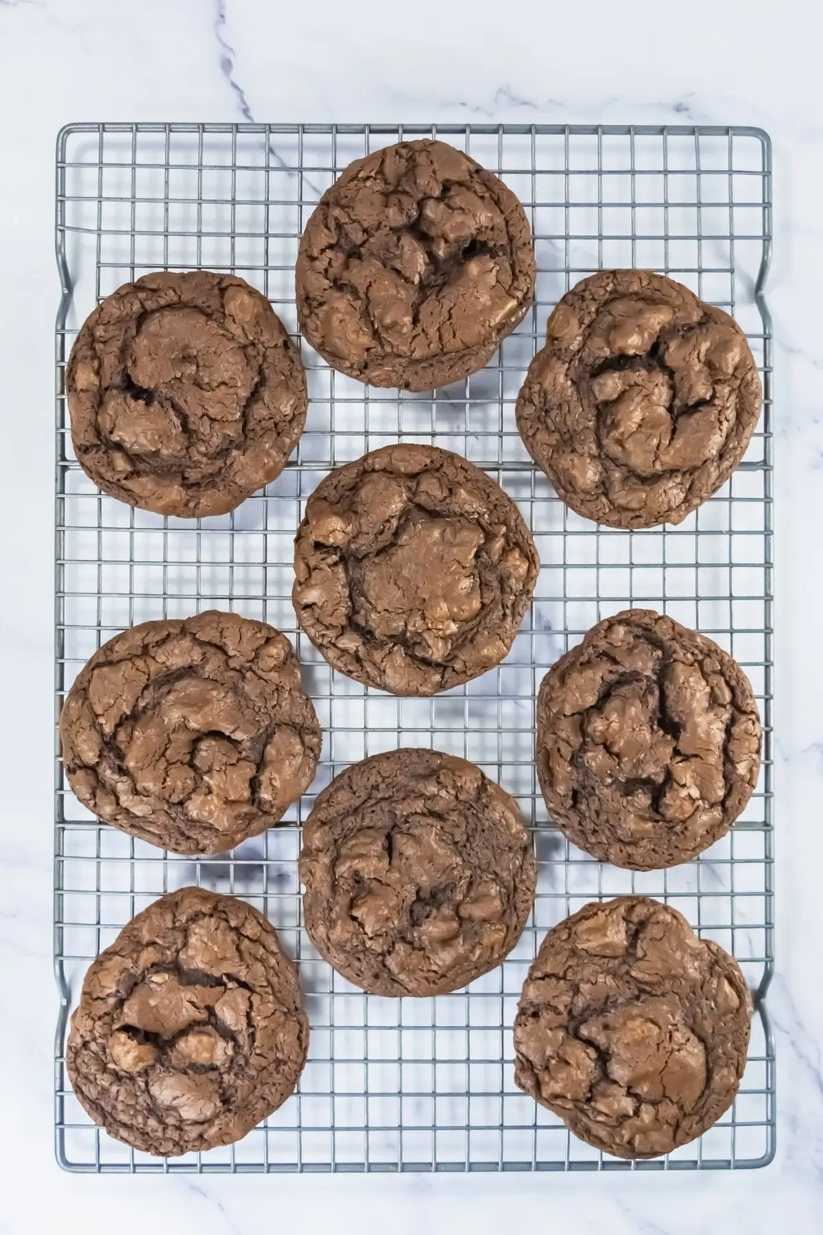 Crumbl Copycat Buckeye Brownie Cookies buckeye cookies on a cooling rack