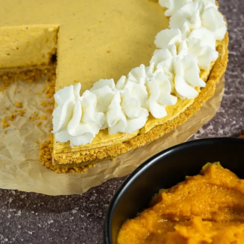 Creamy no bake pumpkin pie with graham cracker crust, topped with whipped cream. A perfect fall dessert for Thanksgiving.