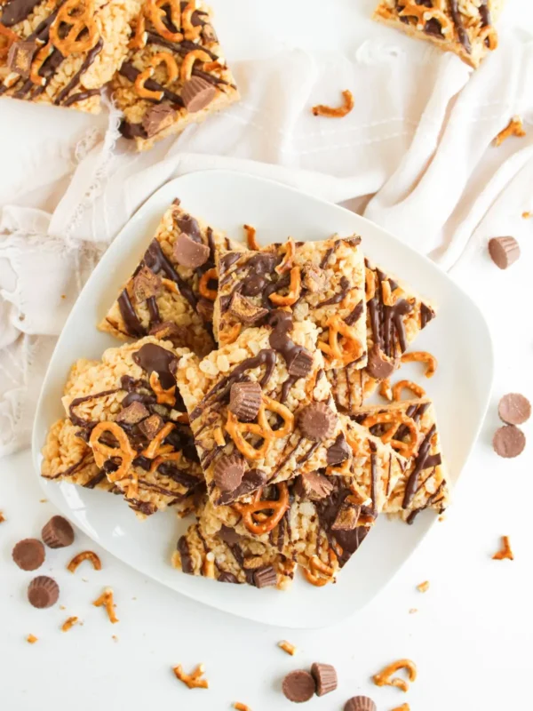 Peanut butter cup pretzel rice krispie treats with chocolate drizzle