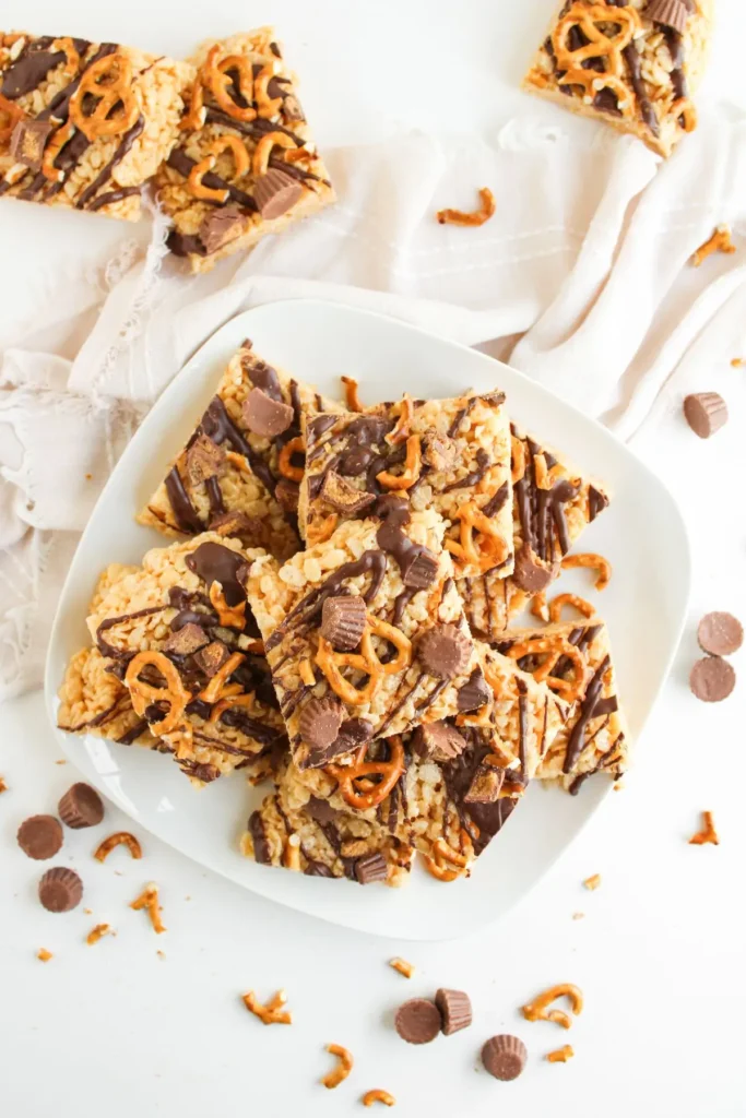 Peanut butter cup pretzel rice krispie treats with chocolate drizzle