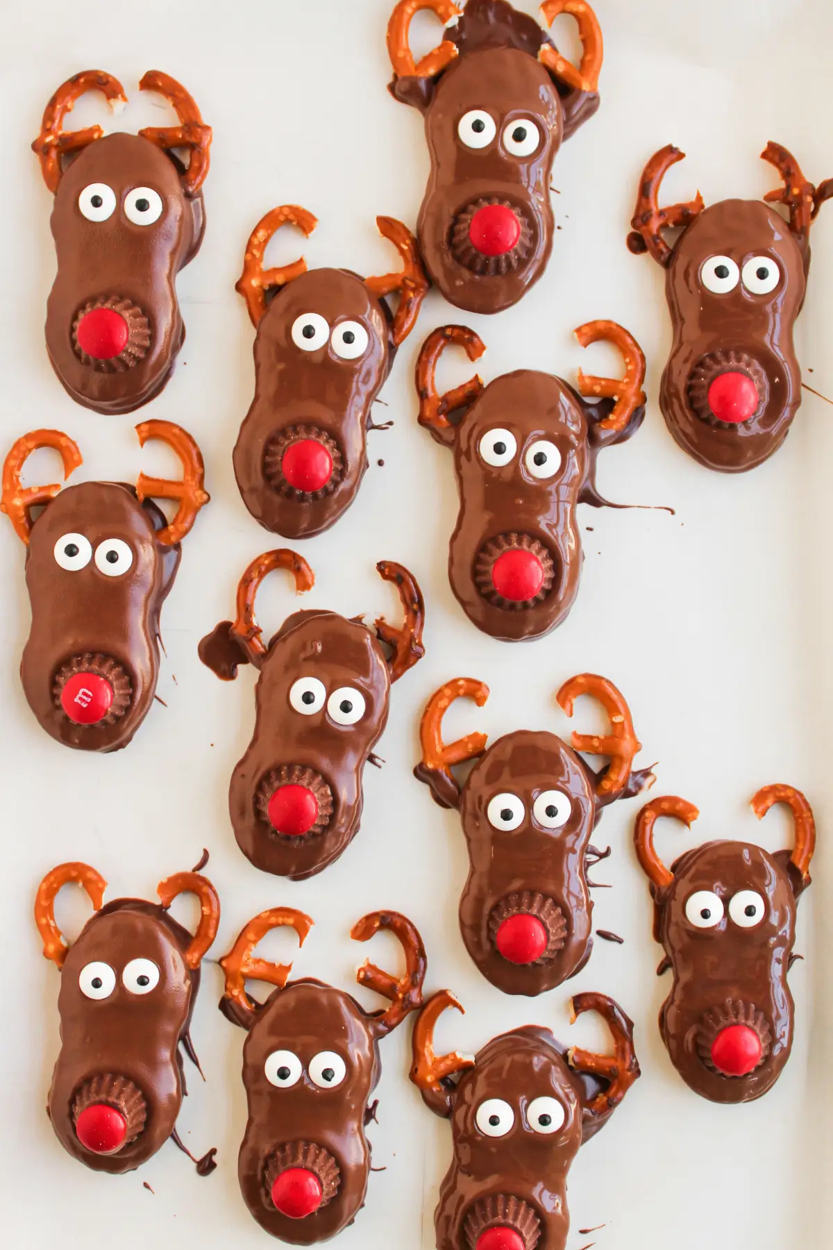 Reindeer Nutter Butter Cookies Chocolate reindeer cookies with pretzel antlers and red noses, Christmas treats