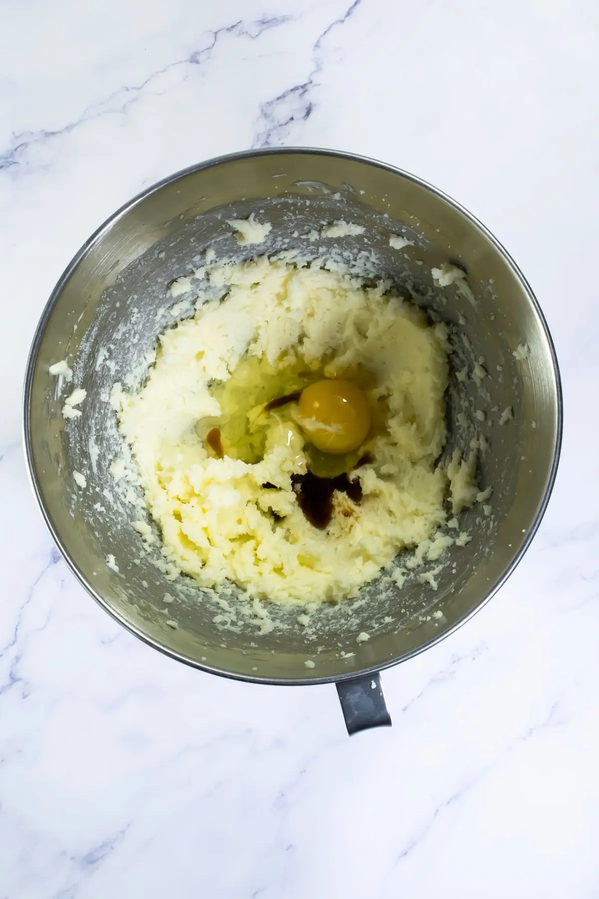 The Bestest Pumpkin Linzer Cookies Egg and vanilla added to creamed butter for cookie dough