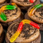 Chocolate dirt cookies with frosting, Oreo crumbs, and gummy worms