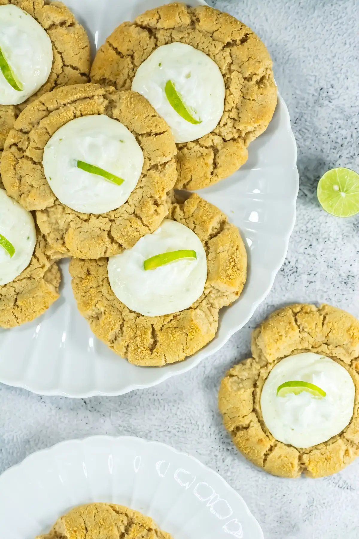 Key Lime Pie Cookies Inspired by Crumble Key lime cheesecake cookies with creamy centers on white plates