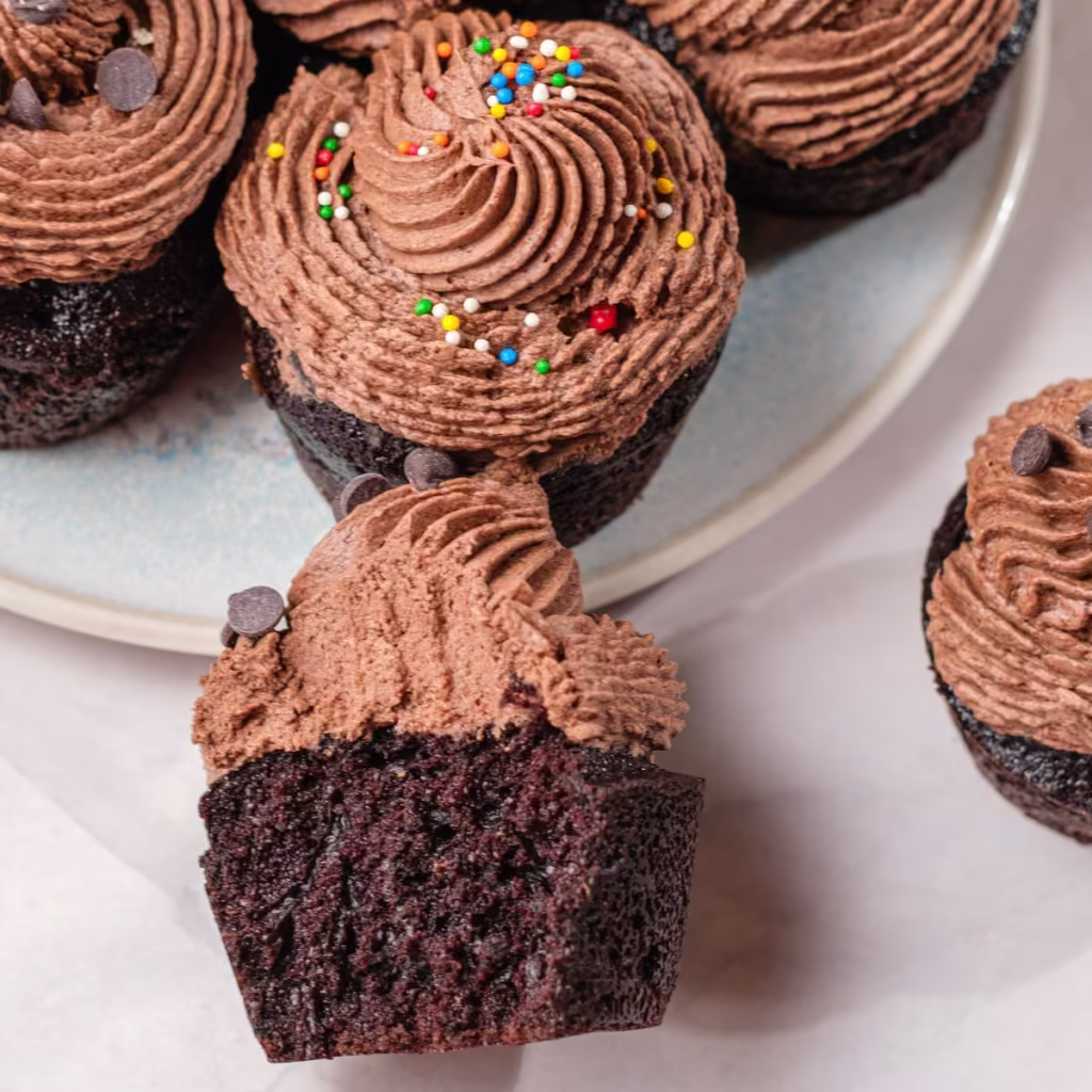 Super moist chocolate ganache cupcakes from scratch with bakery-style piped ganache frosting and a soft chocolate crumb.