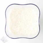 Blended coconut milk and pineapple mixture in a blender