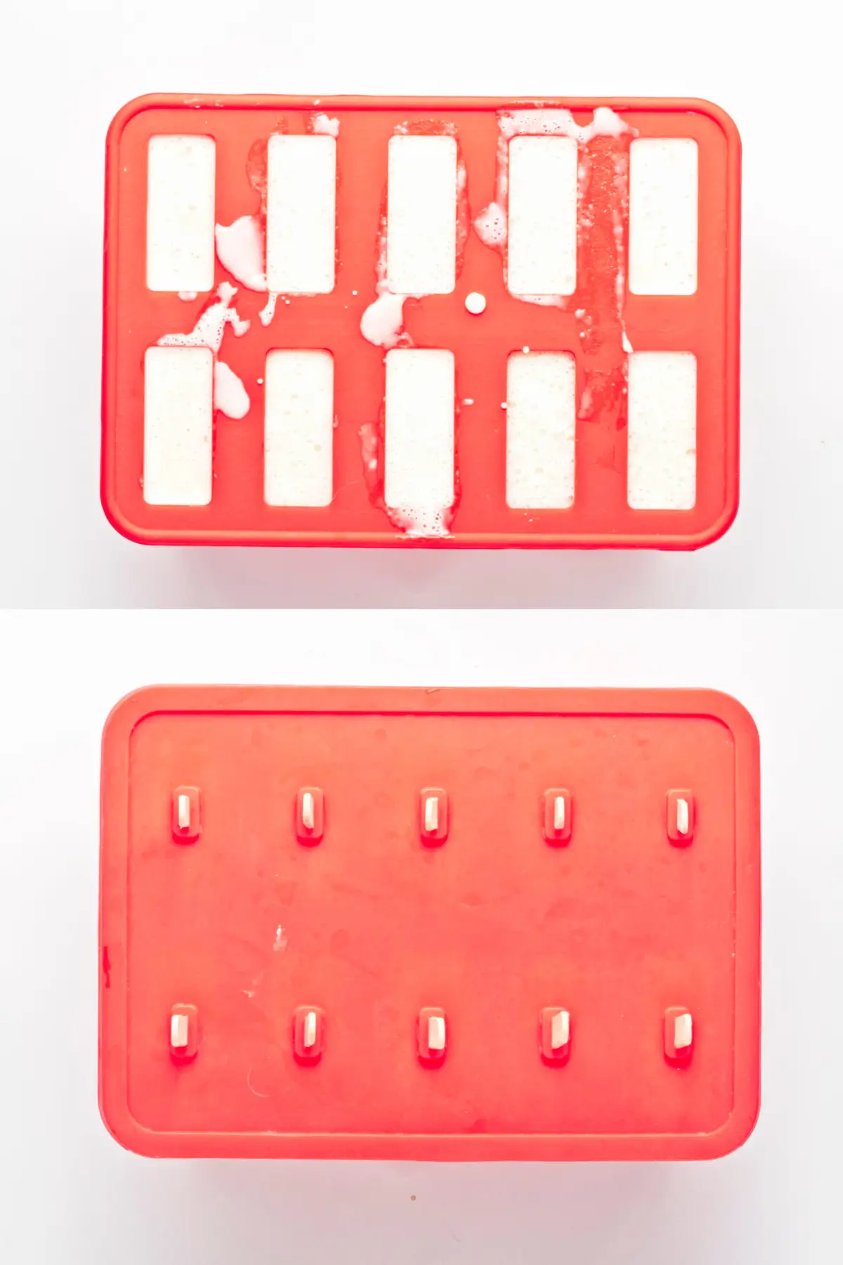 Pina colada popsicle mixture poured into red popsicle molds