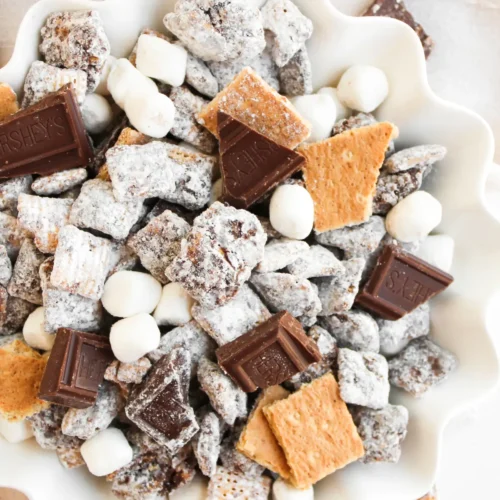 S’mores Muddy Buddies Recipe (S’mores Puppy Chow) Finished S'mores muddy buddies in a white serving bowl