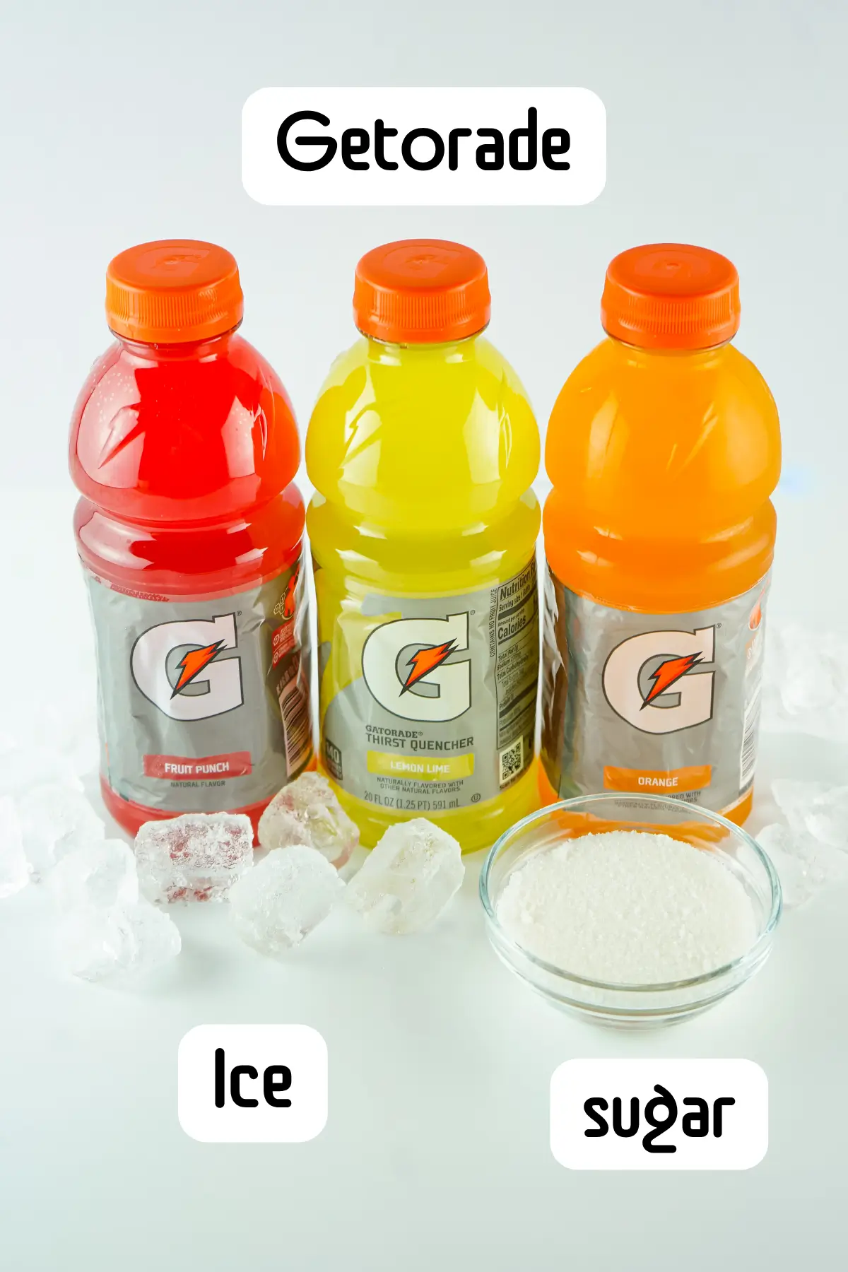 Red, yellow, and orange Gatorade sports drink bottles with ice cubes and a bowl of sugar.