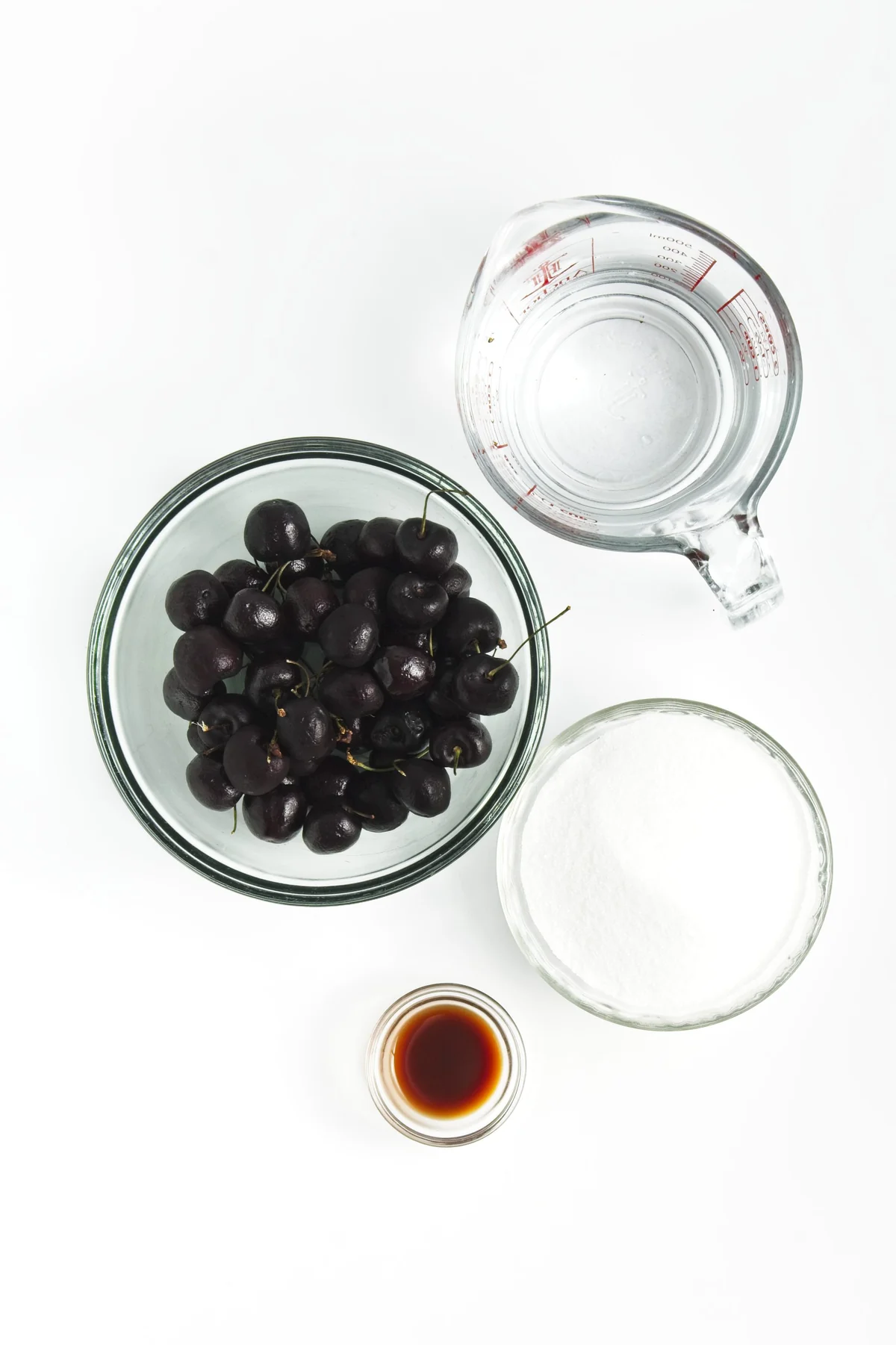 Fresh cherries, sugar, water, and vanilla extract for cherry vanilla soda syrup.