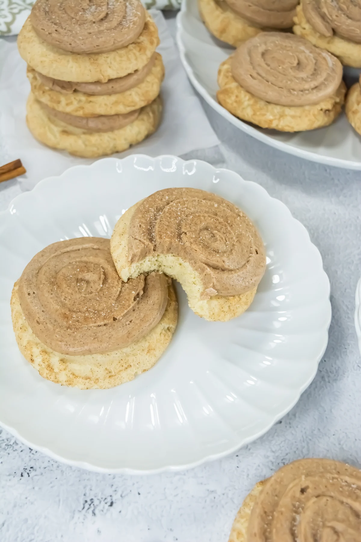 Copycat Crumbl churro cookie with a bite showing the soft center