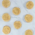 Flattened churro cookie dough disks ready to bake