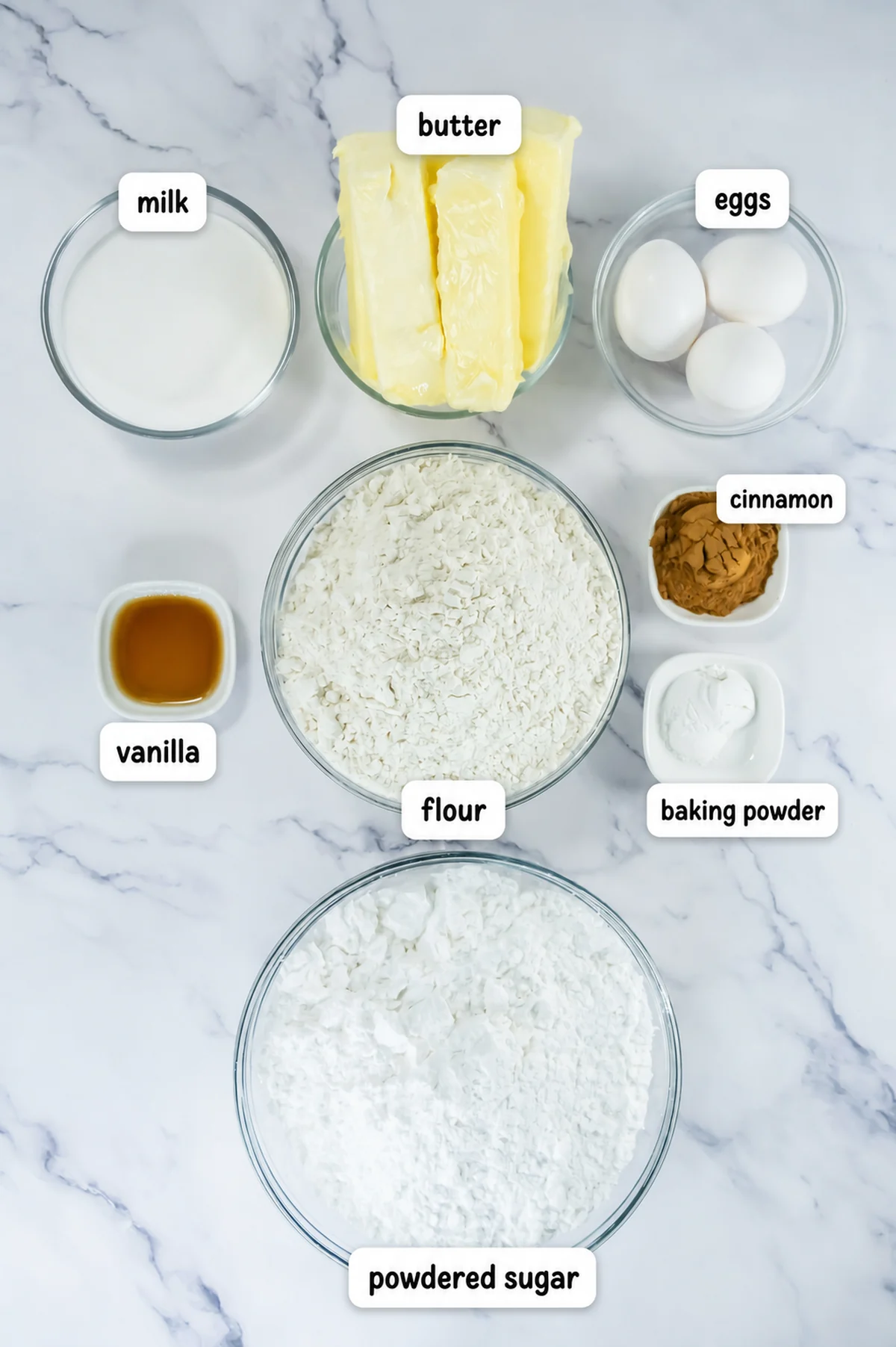Ingredients for copycat Crumbl churro cookies labeled on a marble surface