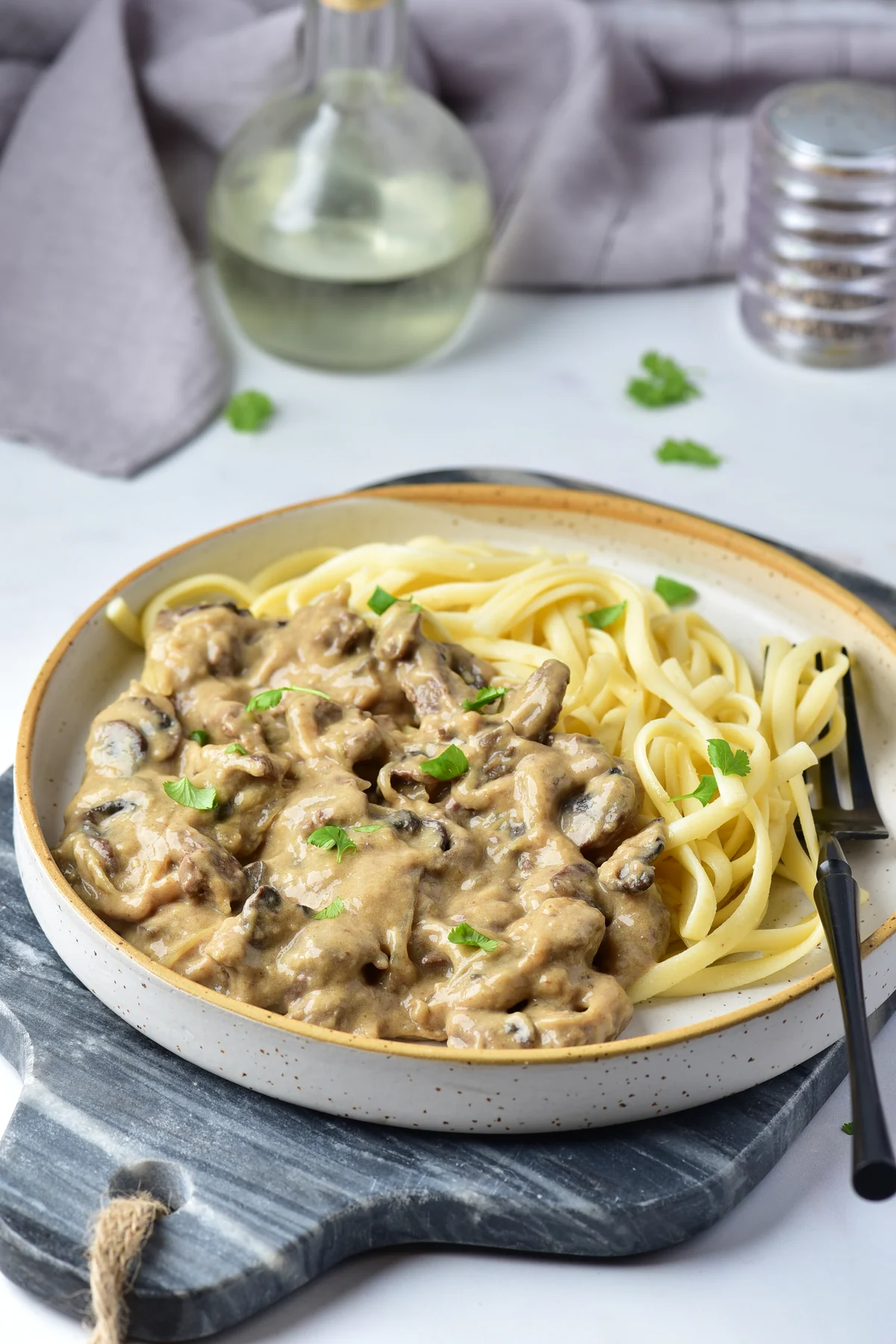 Creamy venison stroganoff with mushrooms served over egg noodles