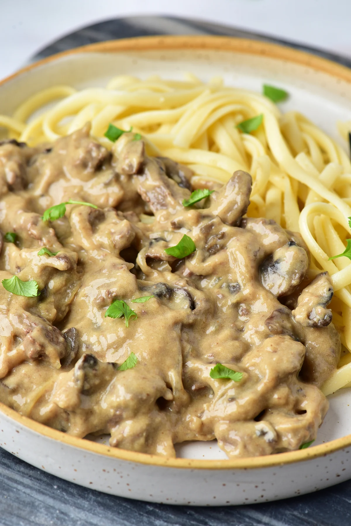Creamy venison stroganoff with mushrooms and parsley