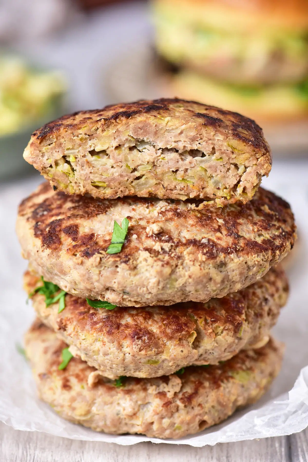 Stacked ground chicken patties showing hidden cabbage inside