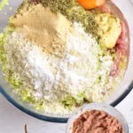 Ground chicken burger ingredients mixed in a bowl