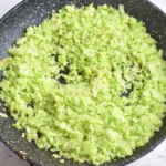 Chopped cabbage and onion softened in a skillet