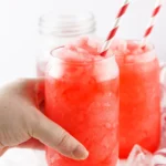 A Hawaiian Punch slushie being held and served immediately.