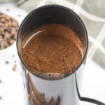 How to Make Ground Allspice From Whole Berries Fresh ground allspice powder inside a spice grinder.