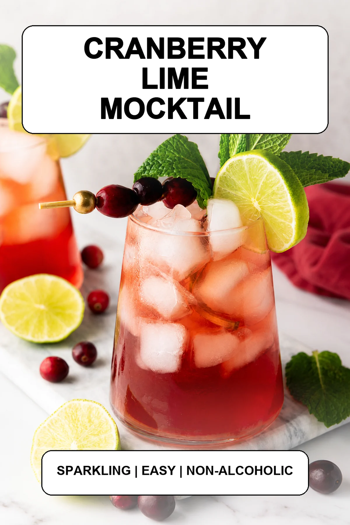 Pinterest pin for a sparkling cranberry lime mocktail.