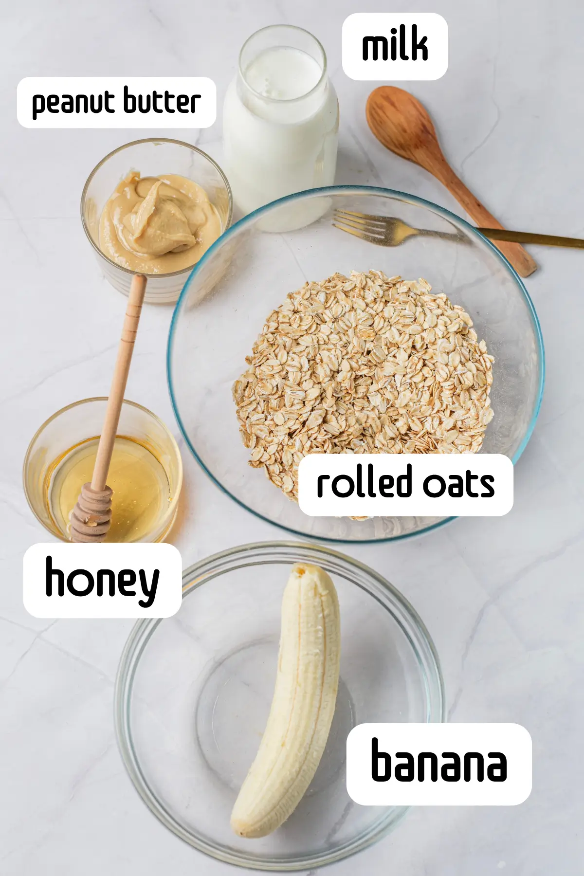 Peanut Butter Banana Overnight Oats Without Yogurt Ingredients for peanut butter banana overnight oats labeled with rolled oats, banana, milk, peanut butter, and honey.