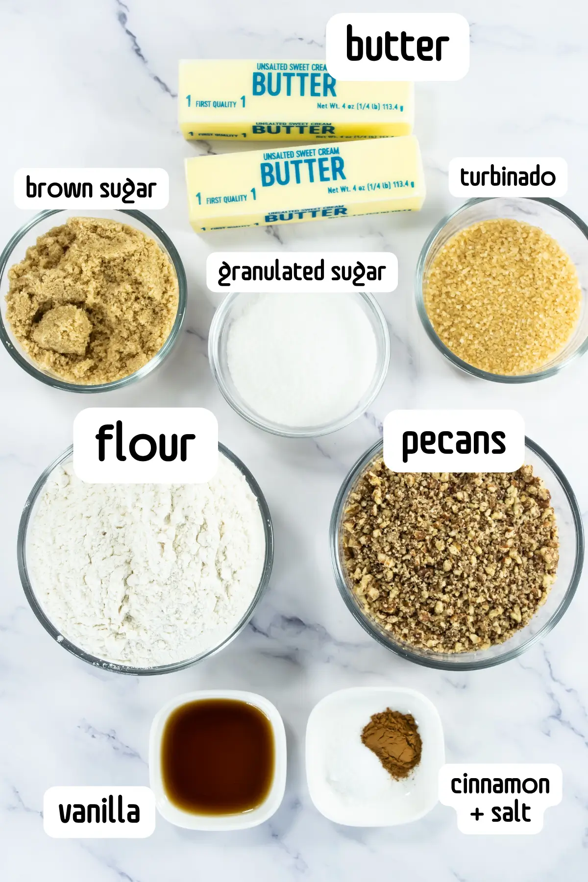 Ingredients for pecan shortbread cookies, including butter, flour, sugars and chopped pecans.