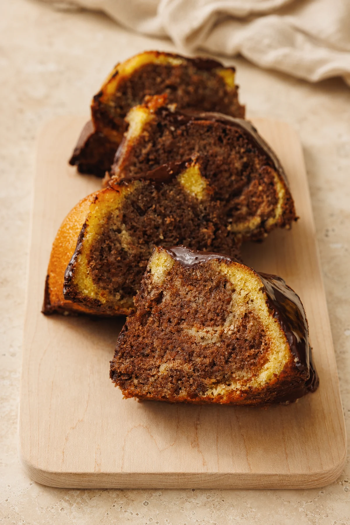 Slices of small cinnamon swirl Bundt cake showing the cocoa-cinnamon ribbons.