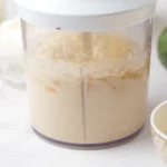 Smooth blended hummus in a food processor