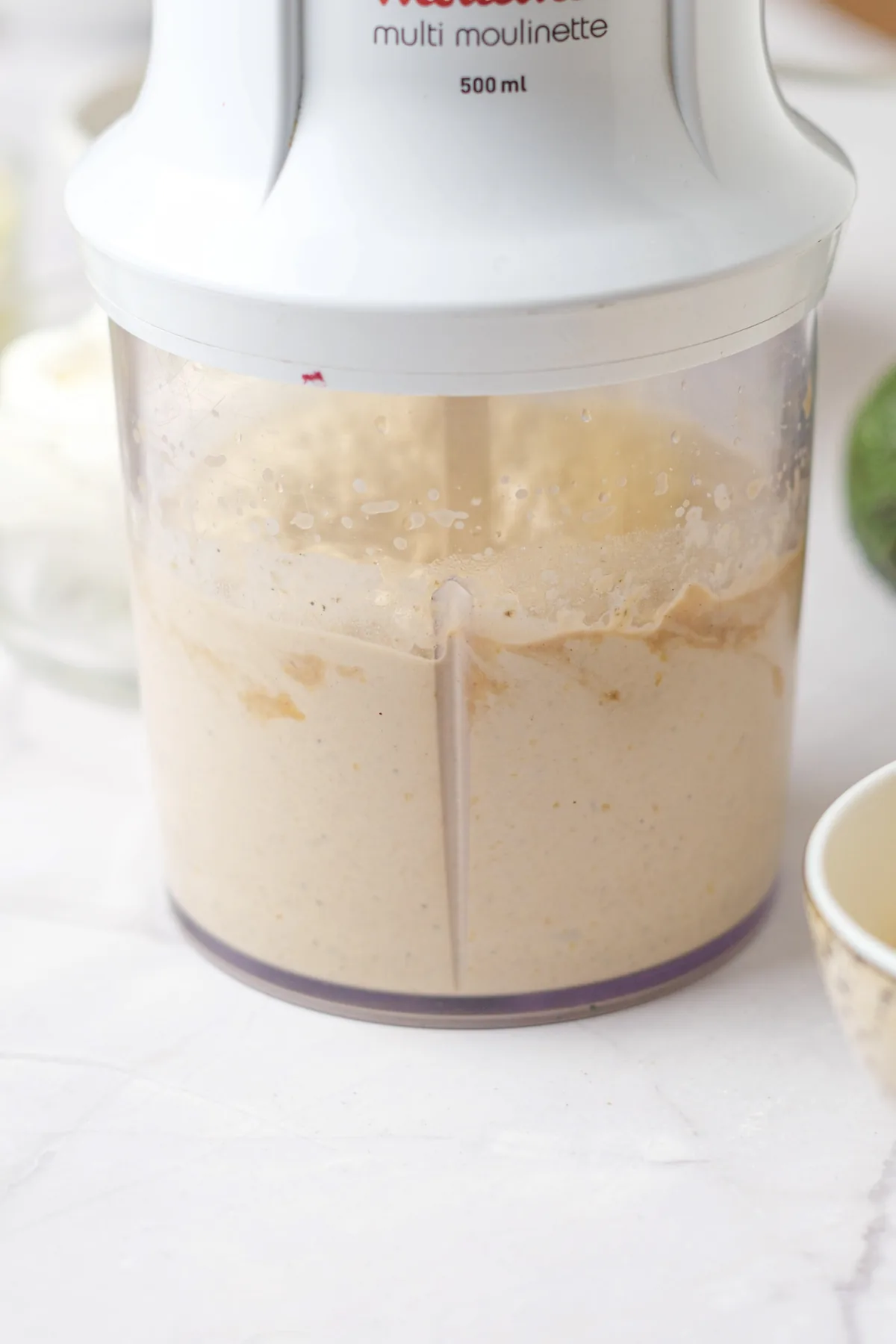 Smooth blended hummus in a food processor