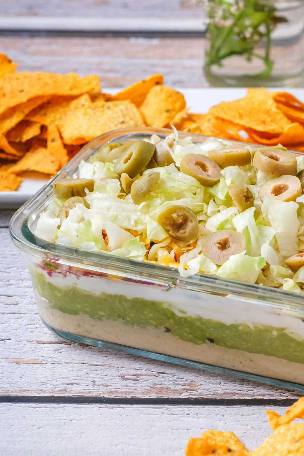 Delicious homemade 7 layer dip with hummus and avocado