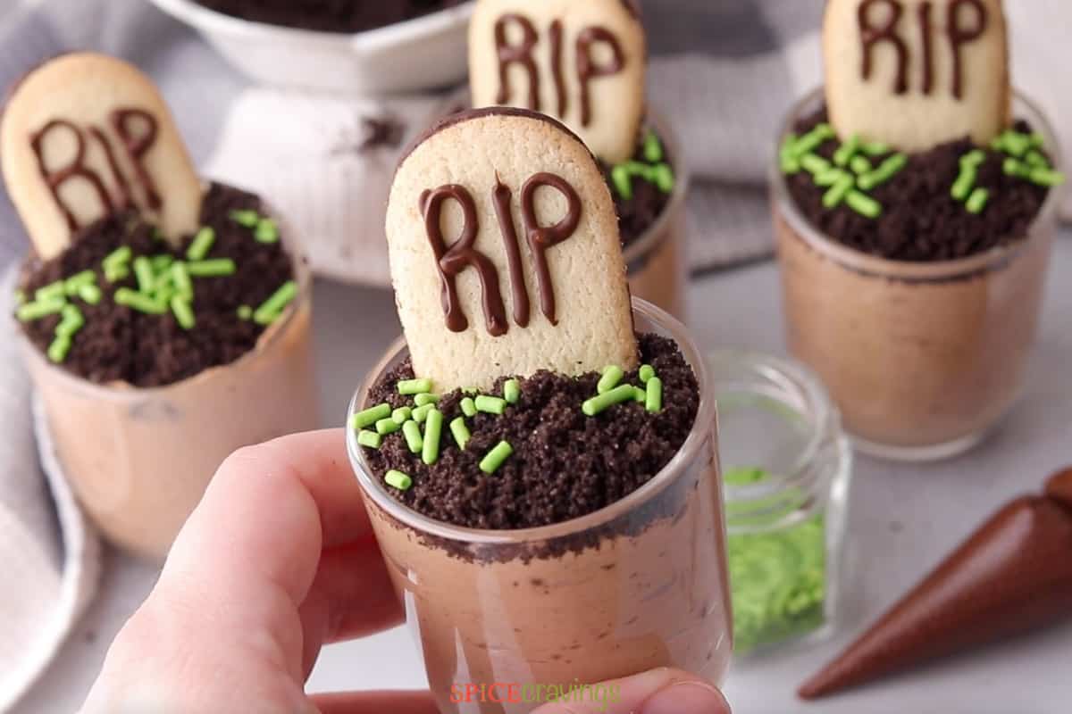 Halloween chocolate mousse desserts with cookie tombstones