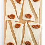 Easy Crescent Roll Churros With Dulce de Leche Crescent dough triangles with a spoonful of dulce de leche on the wide end of each