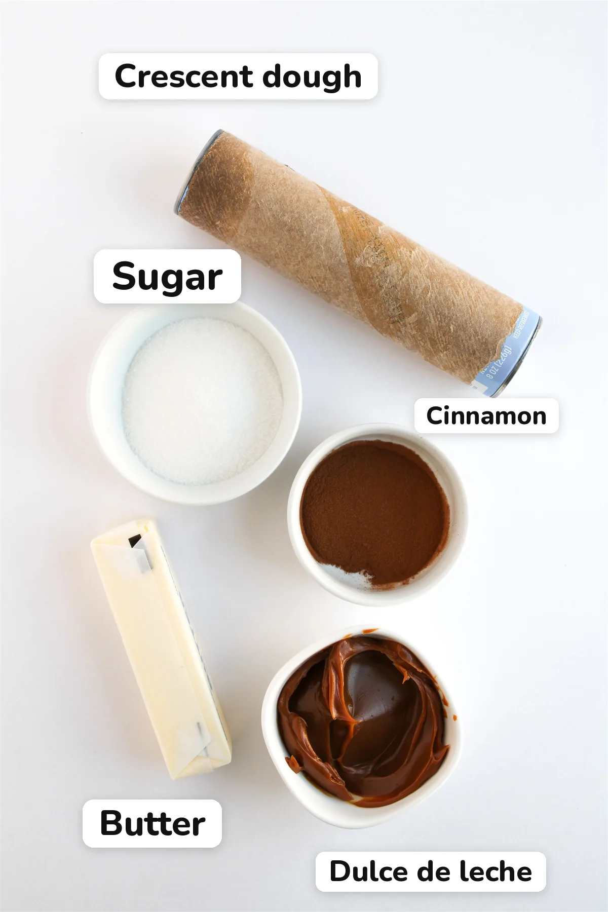 Easy Crescent Roll Churros With Dulce de Leche Ingredients for crescent roll churros: crescent dough, sugar, cinnamon, butter and dulce de leche.
