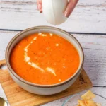 Tomato Bisque Soup With Fresh Tomatoes (Small Batch for Two) Creamy tomato bisque soup in a bowl with fresh ingredients for two