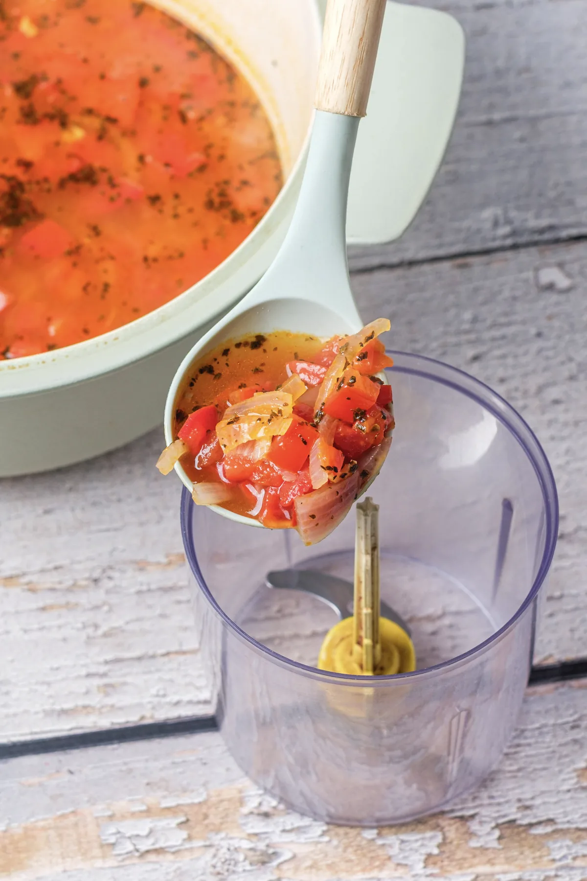 Tomato Bisque Soup With Fresh Tomatoes (Small Batch for Two) Ladling simmered tomato soup into a blender cup