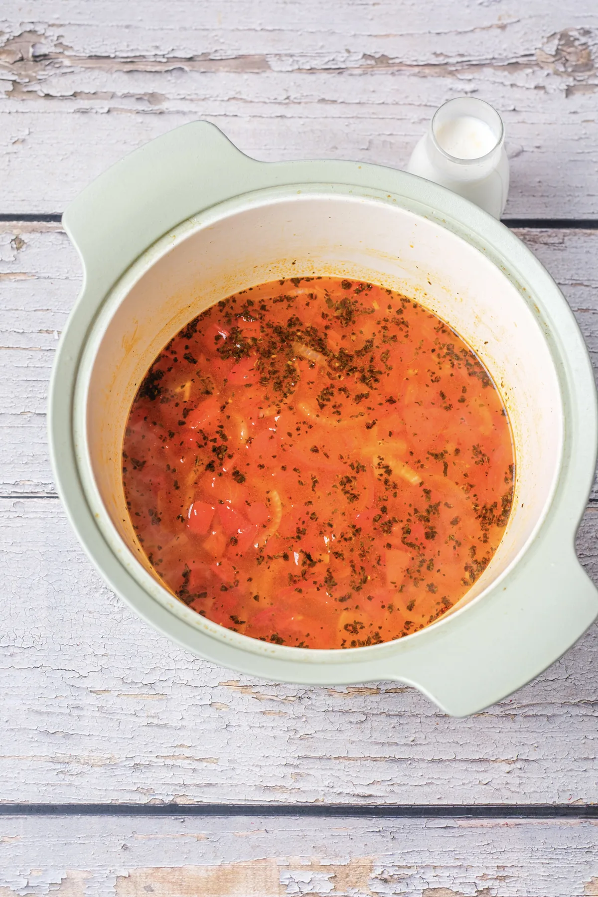 Tomato Bisque Soup With Fresh Tomatoes (Small Batch for Two) Tomato soup after simmering, with the tomatoes broken down and flecks of basil