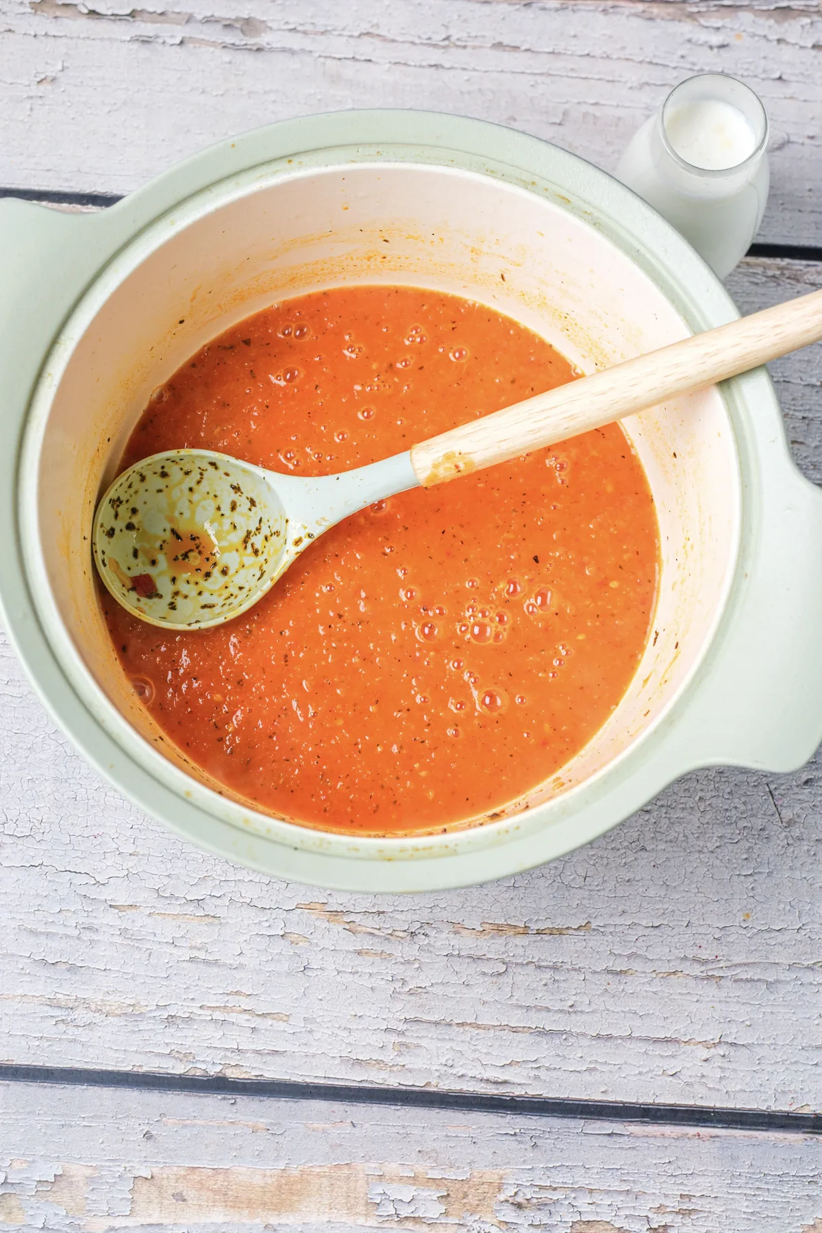 Tomato Bisque Soup With Fresh Tomatoes (Small Batch for Two) Smooth orange tomato bisque in the pot with a ladle