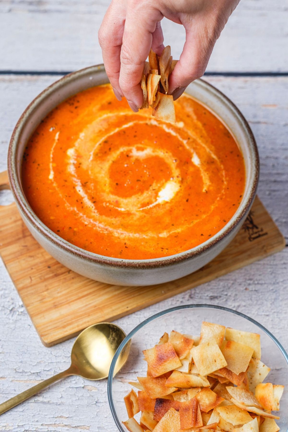 Delicious tomato bisque soup topped with croutons in a bowl.